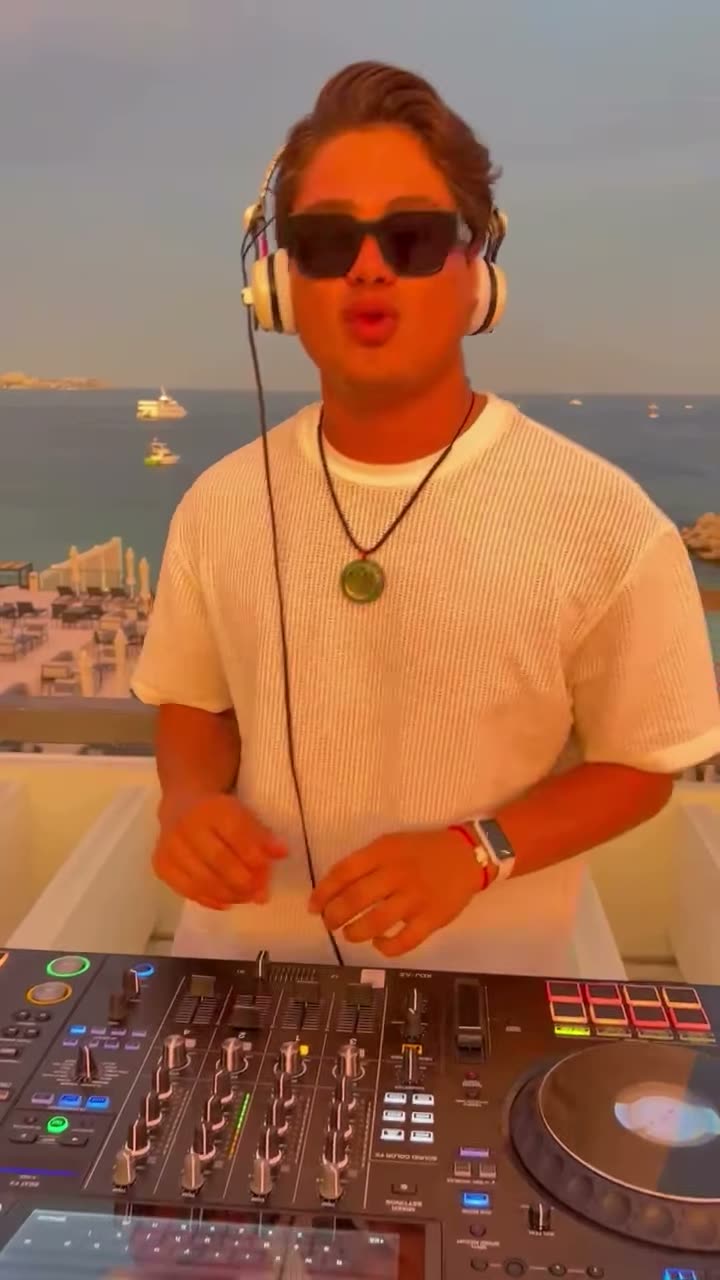 Valdi at the decks on a rooftop at sunset